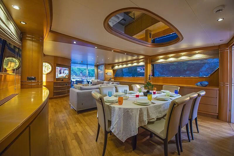 a dining room with a table and chairs aboard LADY EMESA Yacht for Sale