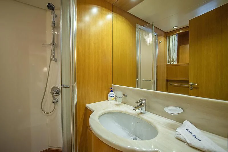 a bathroom with a sink and a mirror aboard LADY EMESA Yacht for Sale