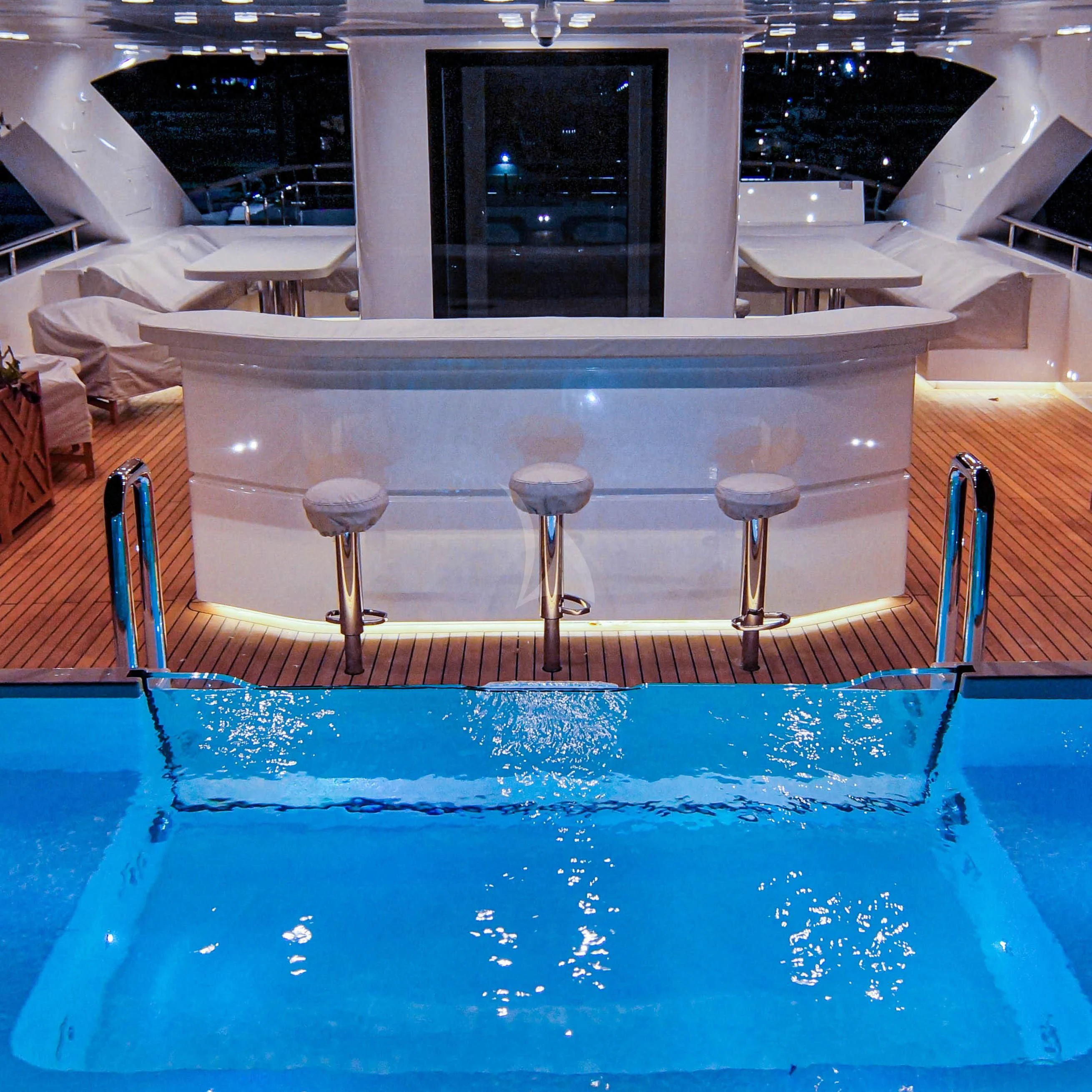 a pool with a blue railing aboard BABA'S Yacht for Sale