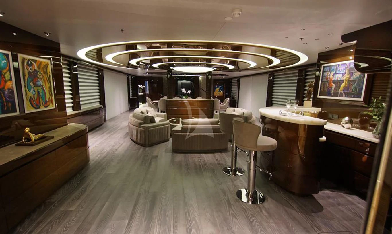 a room with a couch and a television aboard BABA'S Yacht for Sale