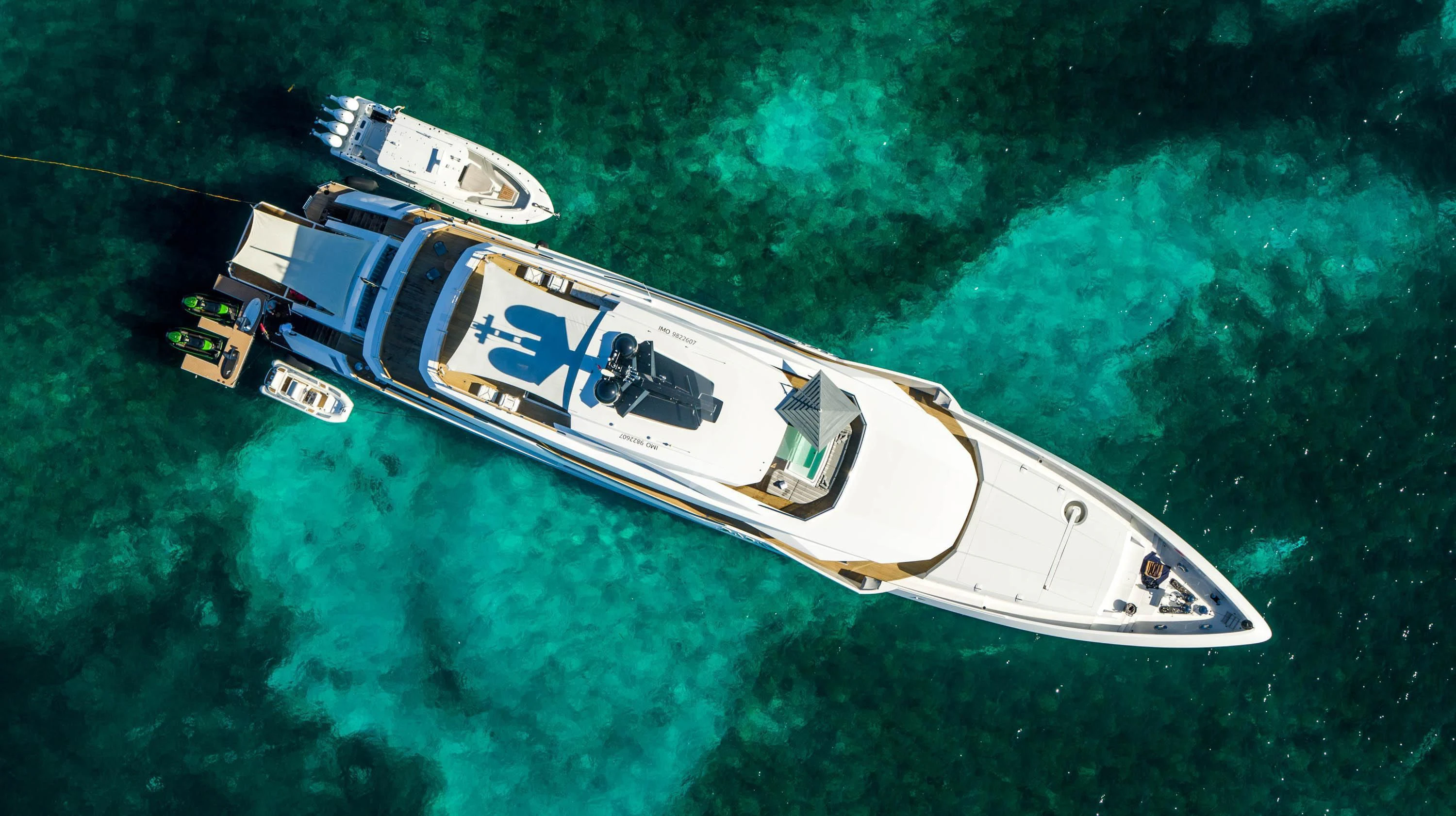 a helicopter flying over a forest aboard BABA'S Yacht for Sale