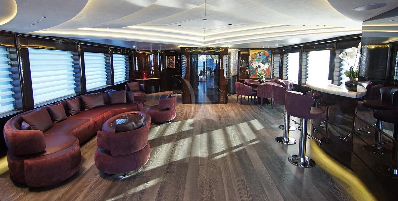 a large room with a wood floor and a large window aboard BABA'S Yacht for Sale