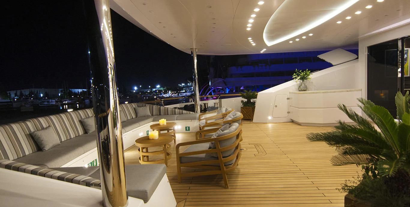 a room with a couch and a table and a plant aboard BABA'S Yacht for Sale