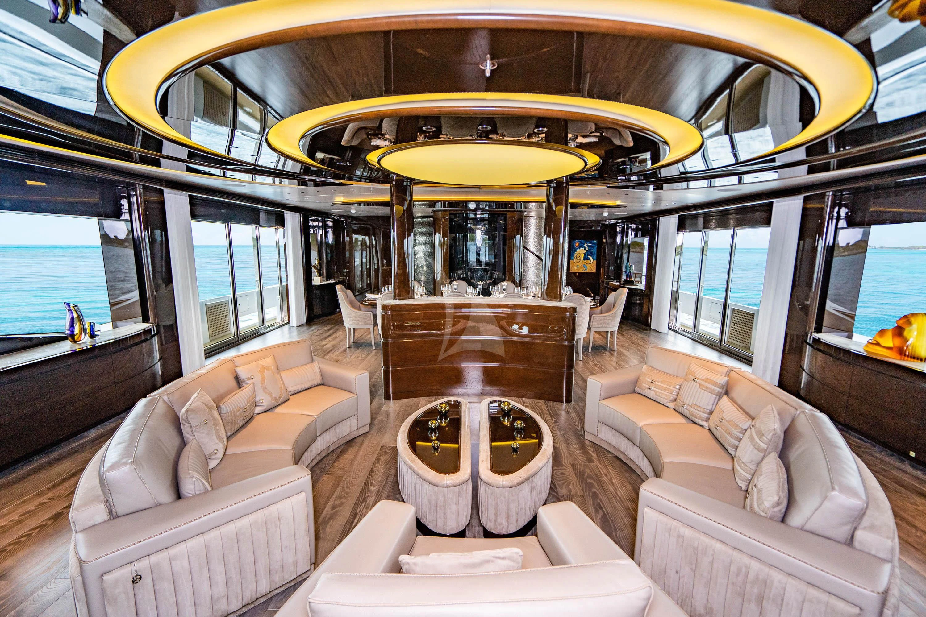 a large room with a couch and a table aboard BABA'S Yacht for Sale