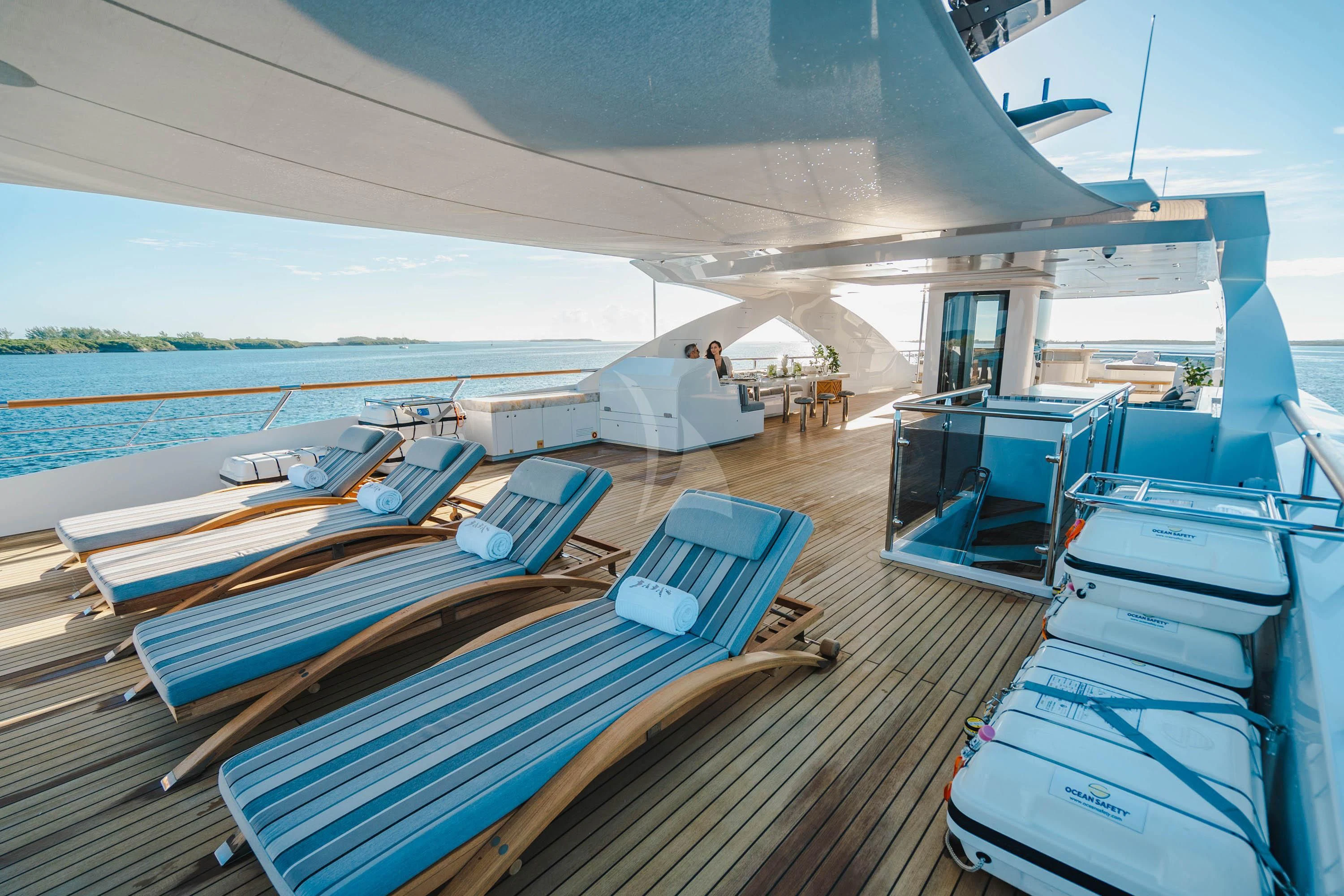 a deck with a deck and a pool aboard BABA'S Yacht for Sale