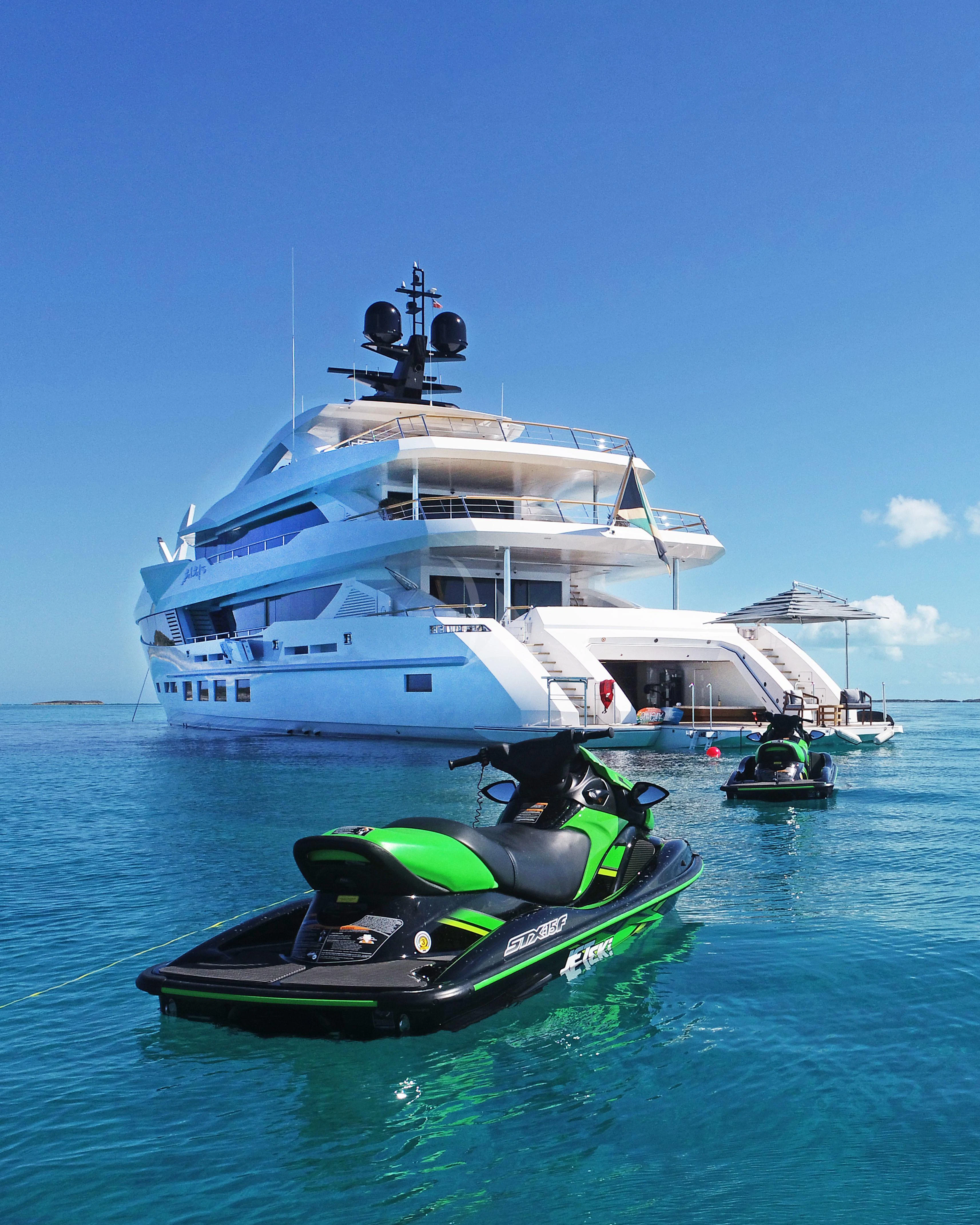 a boat with a motorbike on it aboard BABA'S Yacht for Sale