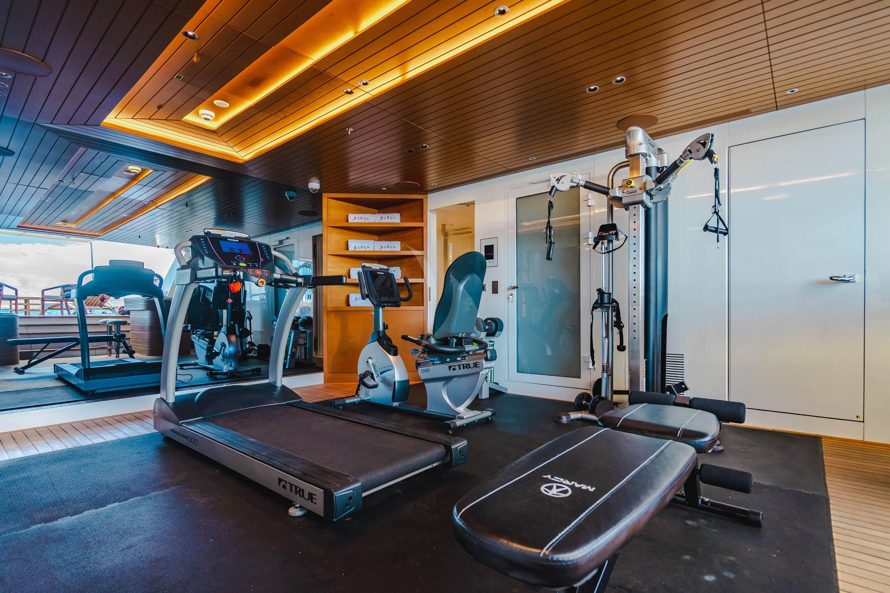 a gym with equipment and equipment aboard BABA'S Yacht for Sale