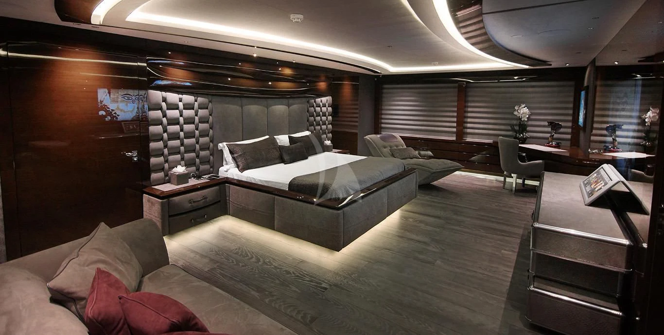a room with a bed and a couch aboard BABA'S Yacht for Sale