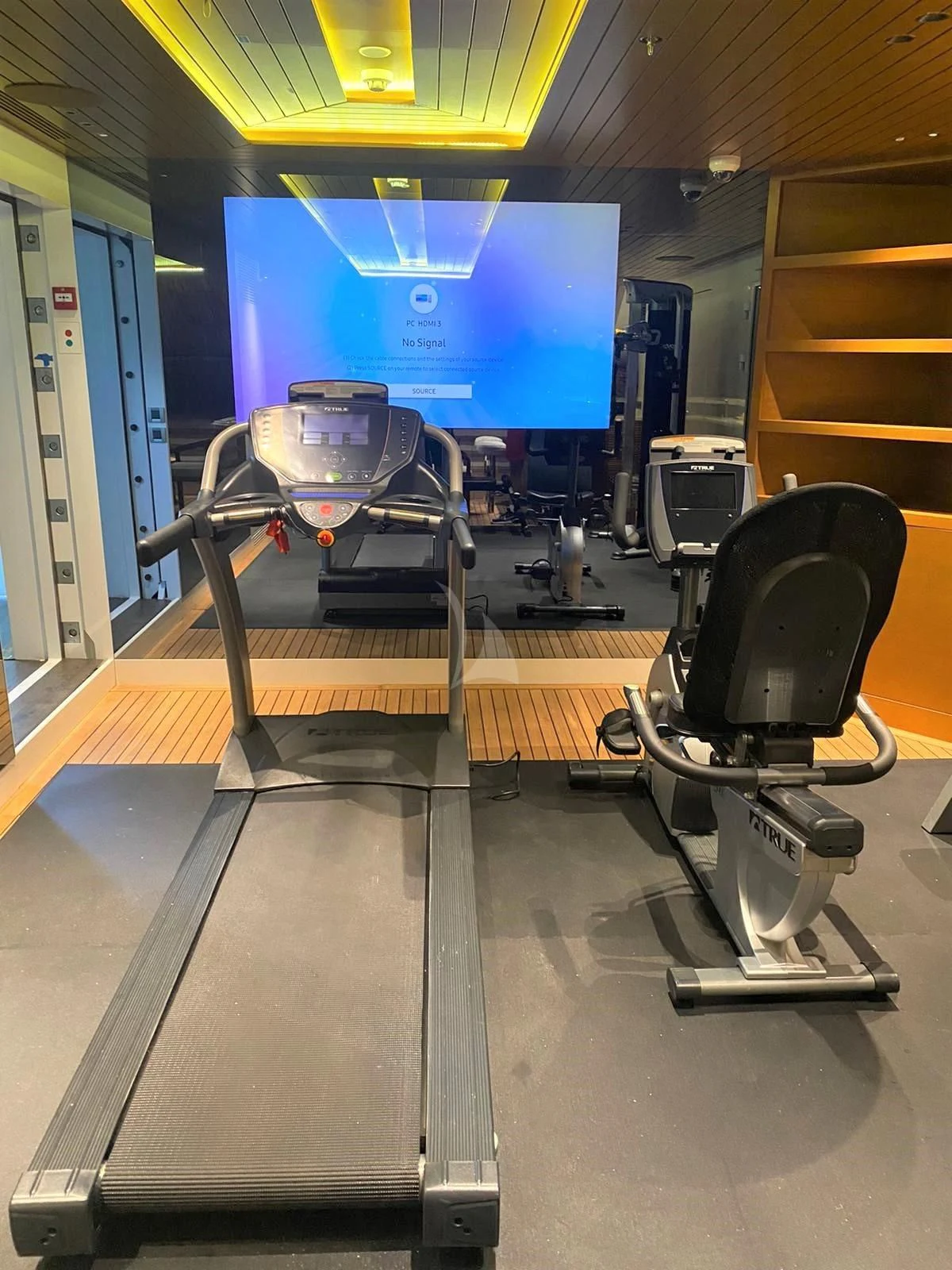 a room with a machine and a chair aboard BABA'S Yacht for Sale