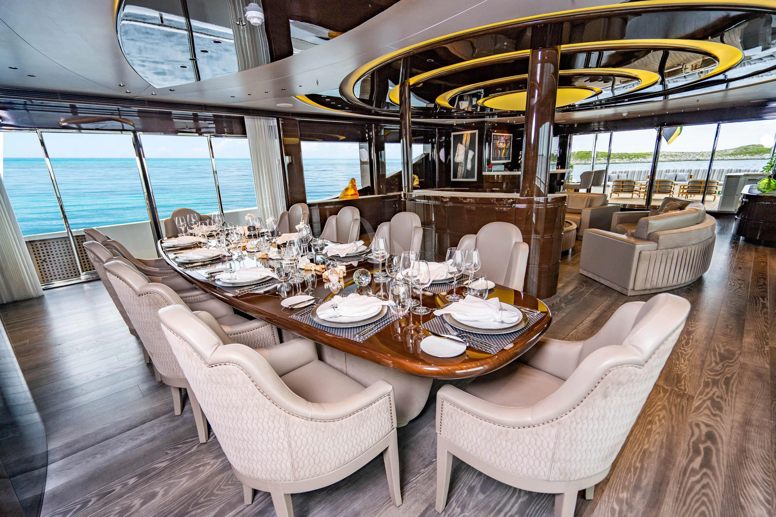 a dining room with a table and chairs aboard BABA'S Yacht for Sale