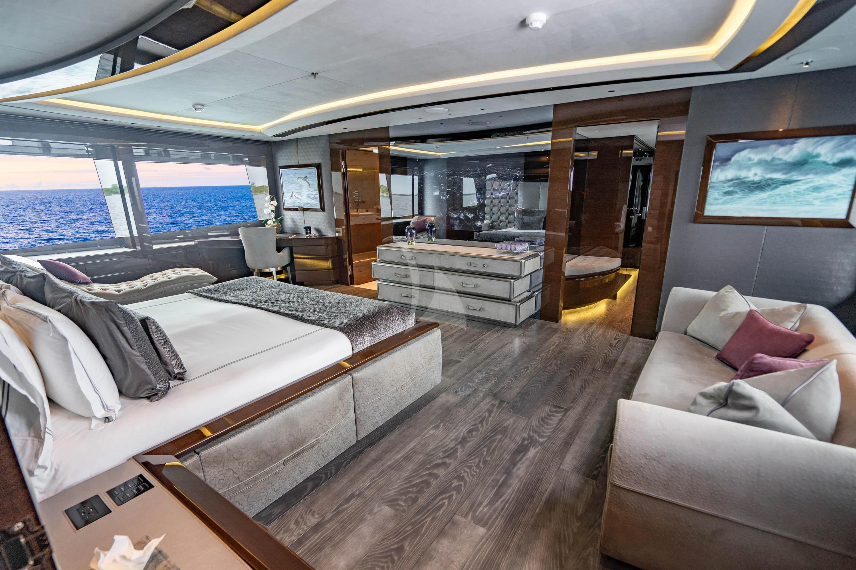 a room with a bed and a couch aboard BABA'S Yacht for Sale
