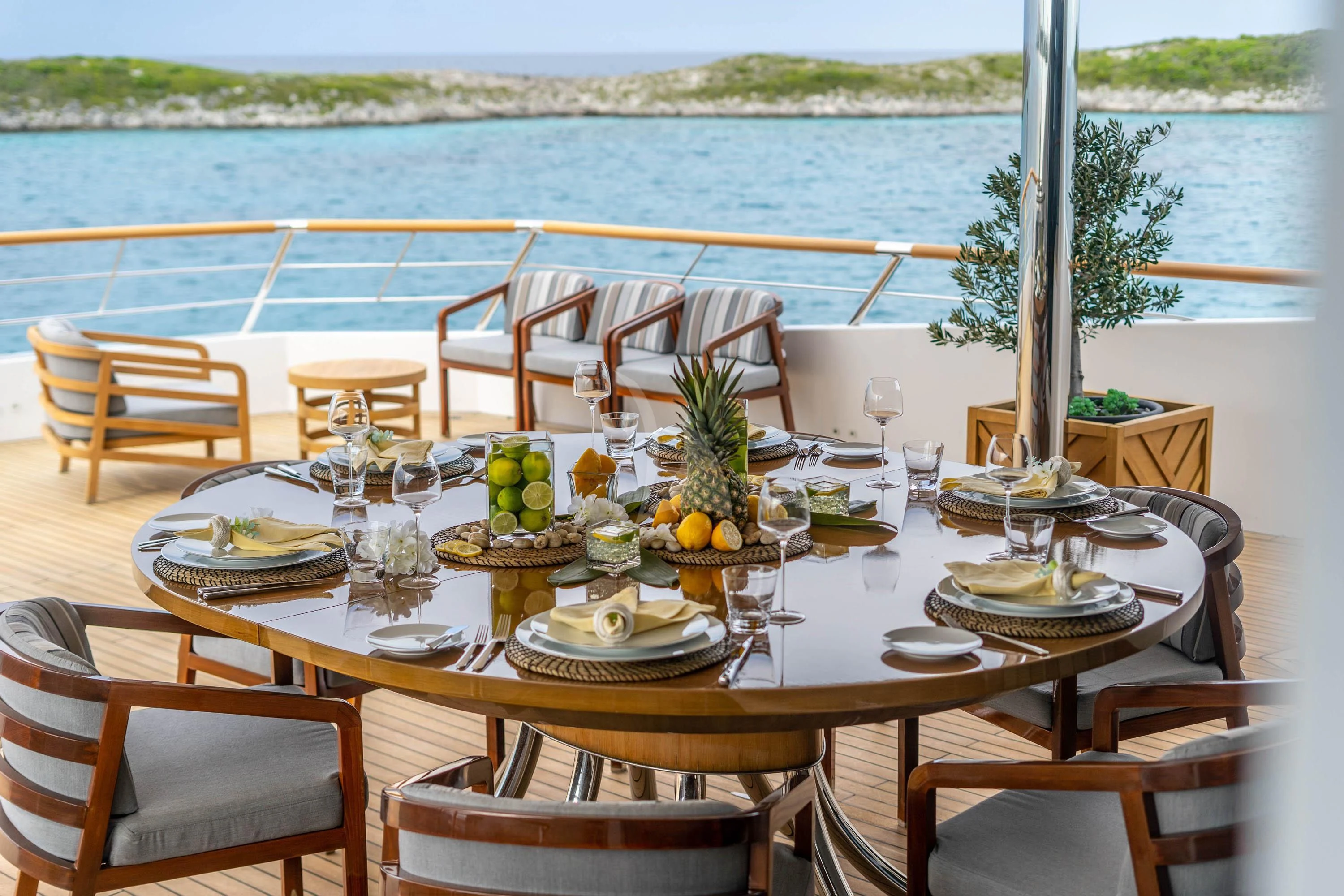 a table set for a dinner party aboard BABA'S Yacht for Sale