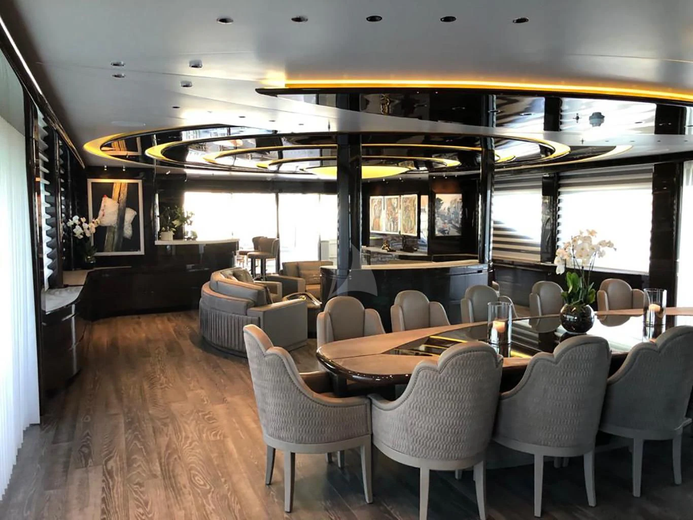 a room with tables and chairs aboard BABA'S Yacht for Sale