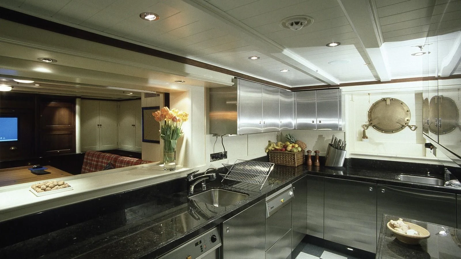 a kitchen with a large island aboard BYSTANDER Yacht for Sale