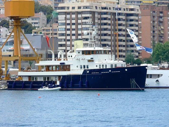 a large boat docked at a port aboard BYSTANDER Yacht for Sale