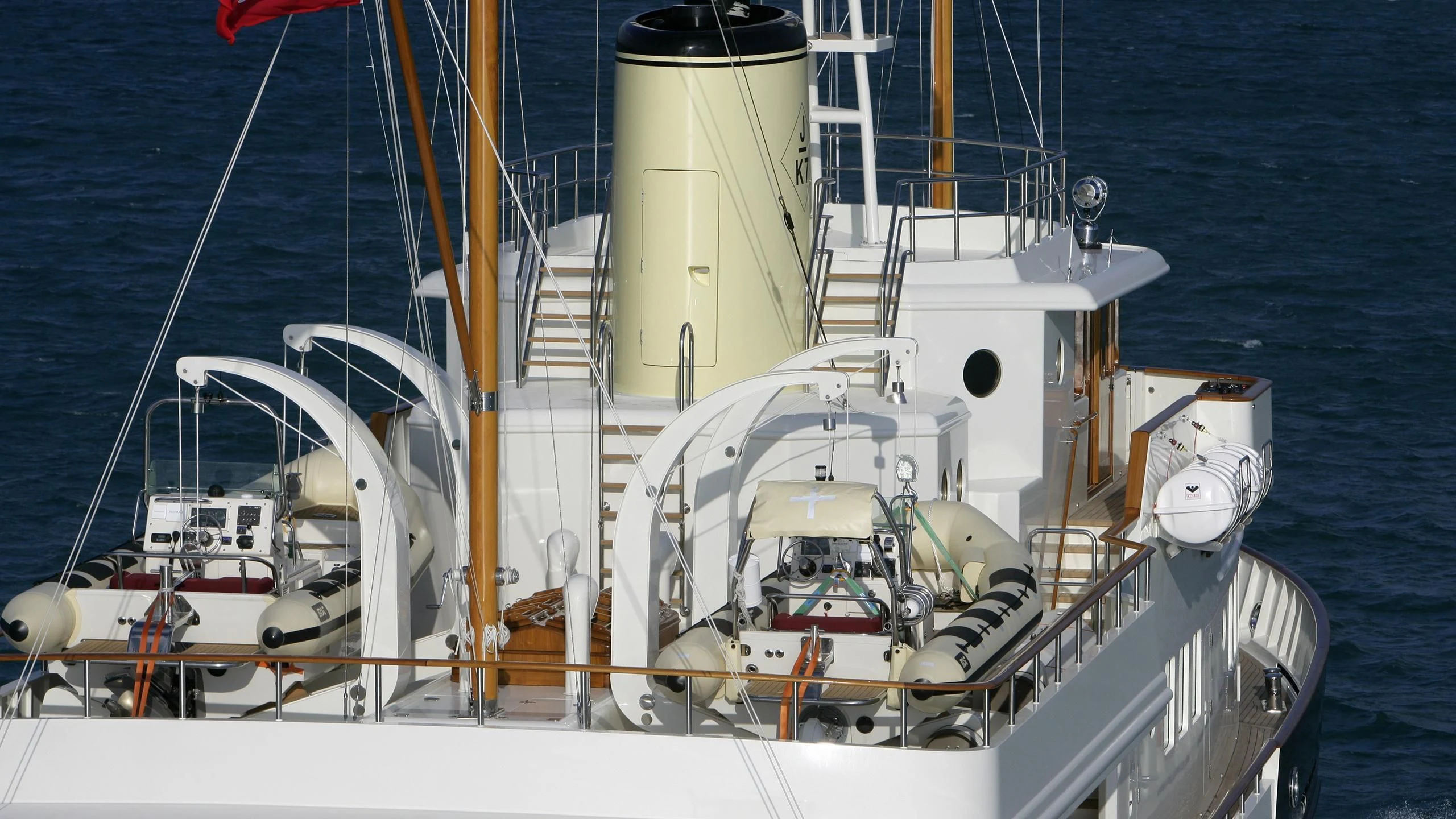 a large white boat on the water aboard BYSTANDER Yacht for Sale