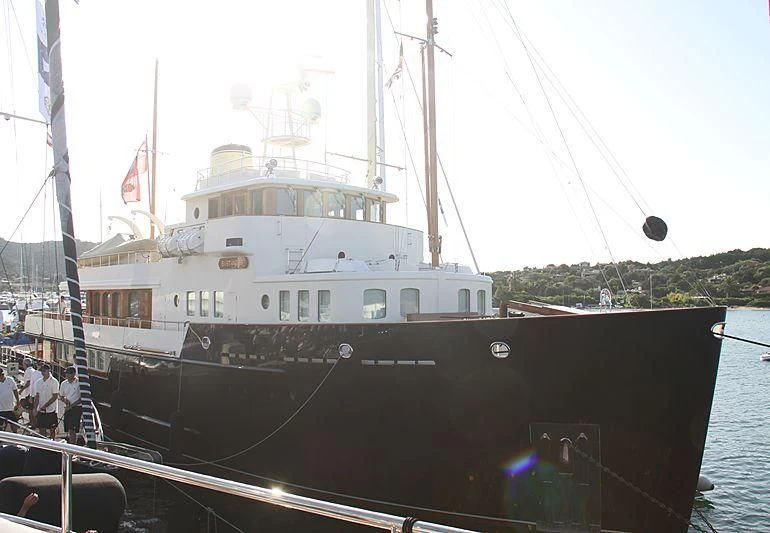 a large white boat on the water aboard BYSTANDER Yacht for Sale