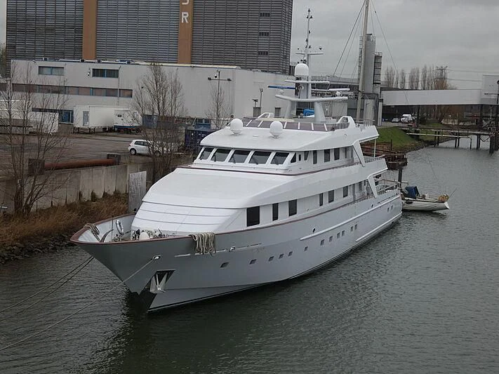 a large white boat in a body of water aboard ANNA J Yacht for Sale