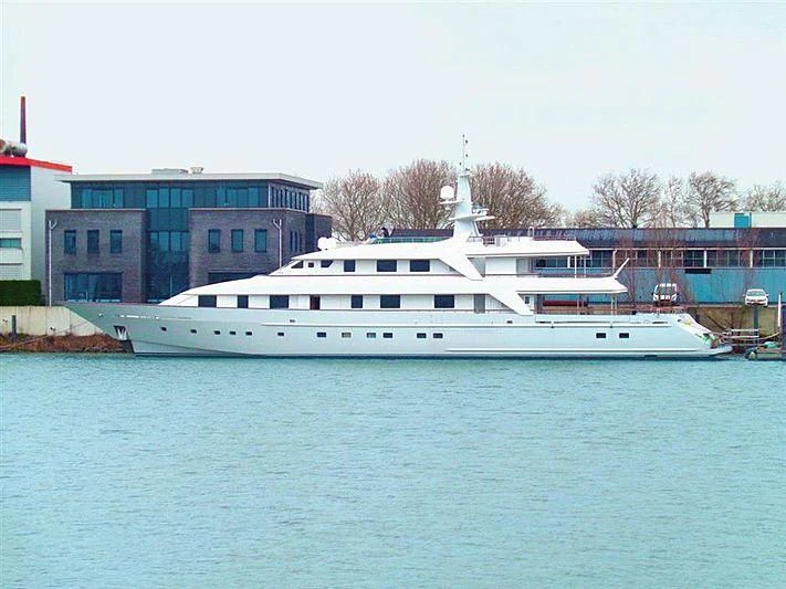 a white boat in a harbor aboard ANNA J Yacht for Sale