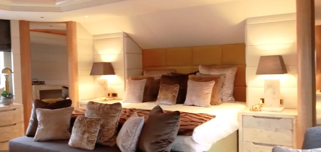 a large bed with pillows aboard ANNA J Yacht for Sale