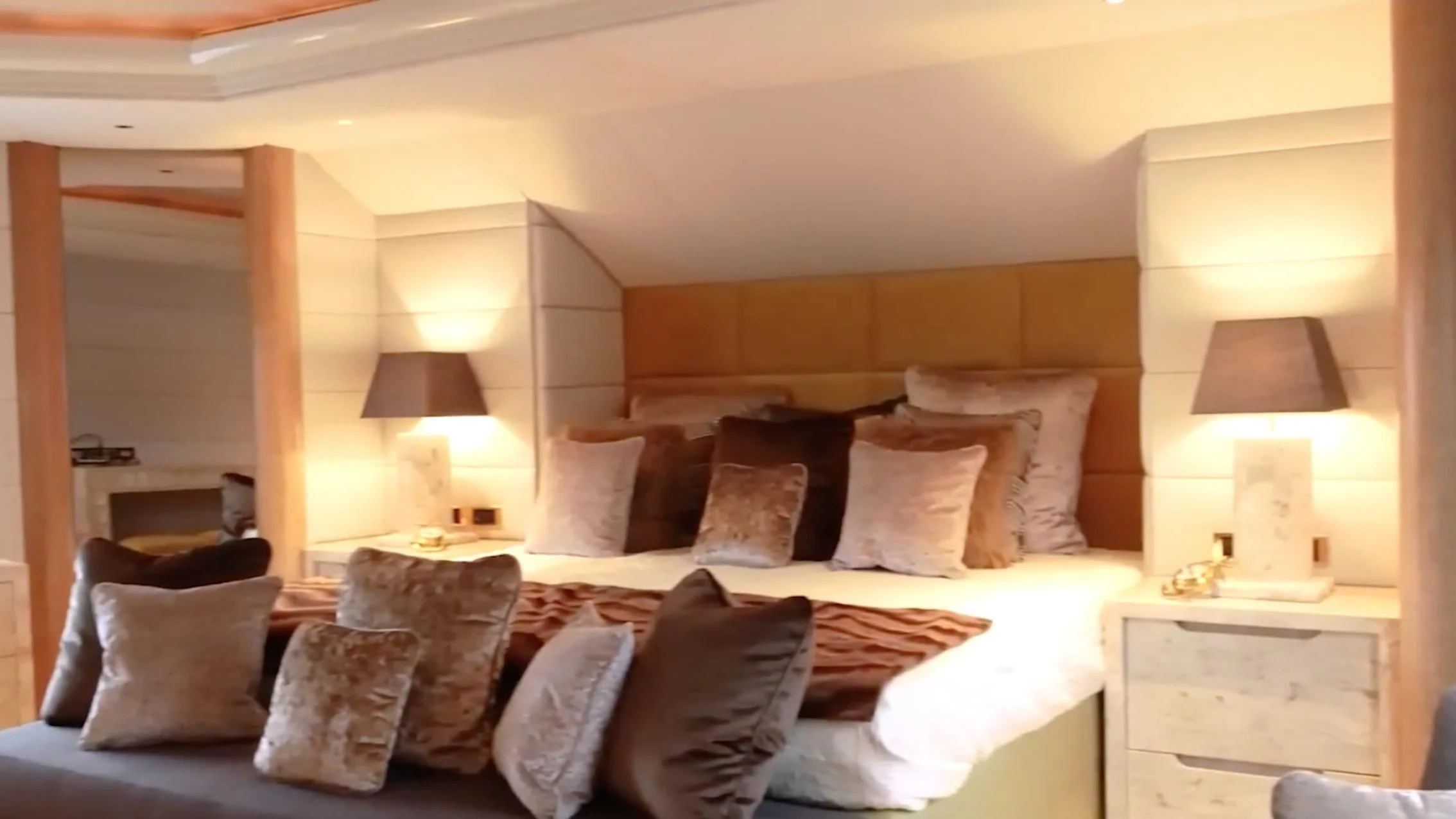 a large bed with pillows aboard ANNA J Yacht for Sale