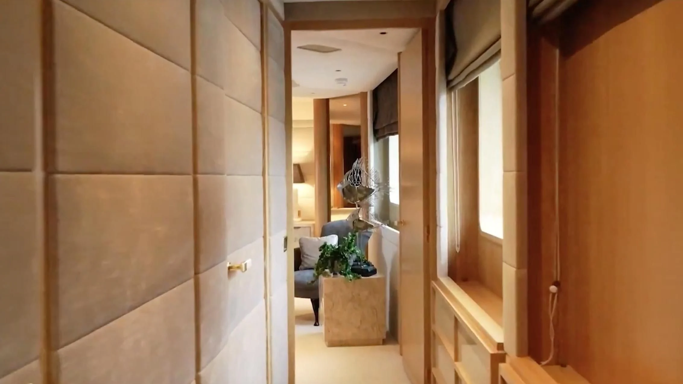 a room with a glass wall aboard ANNA J Yacht for Sale