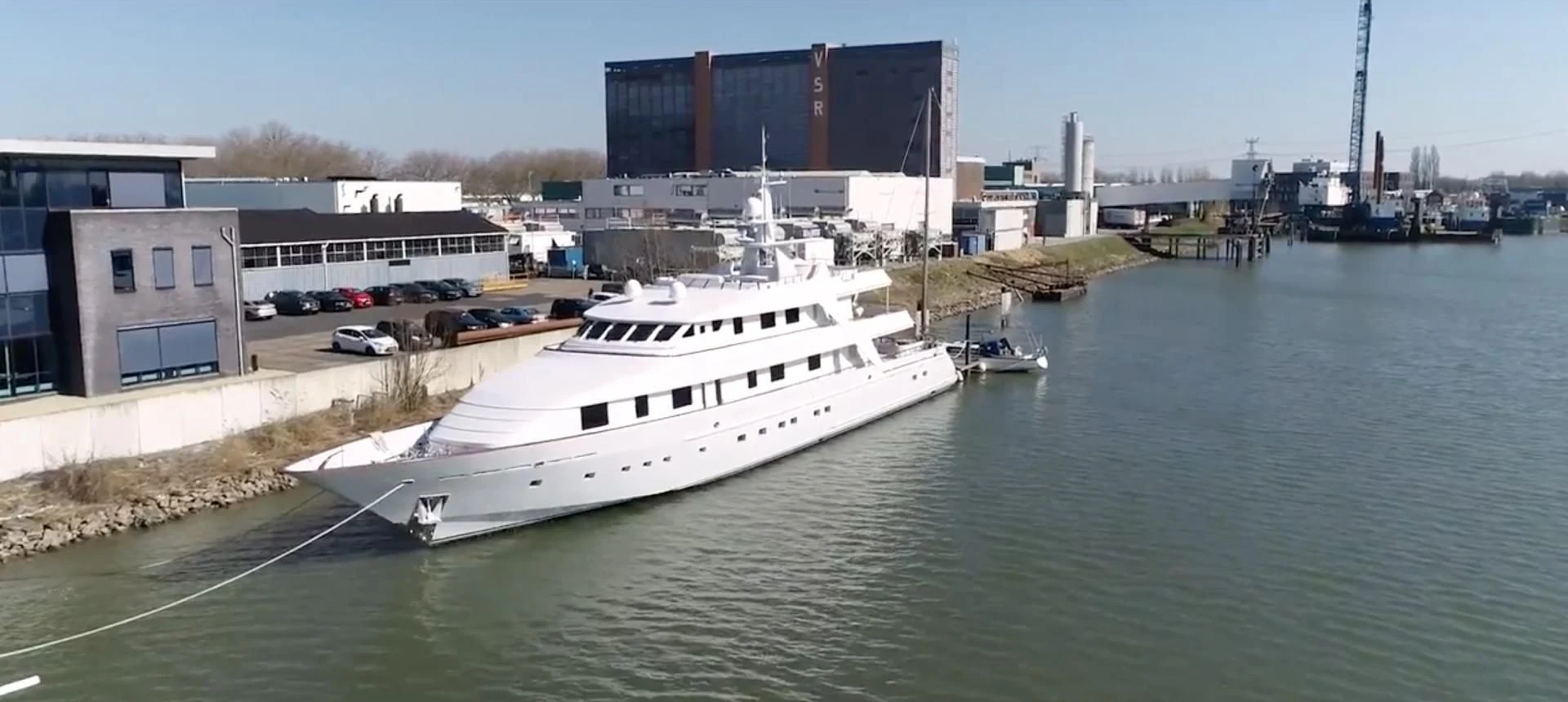 a large white boat in a body of water aboard ANNA J Yacht for Sale