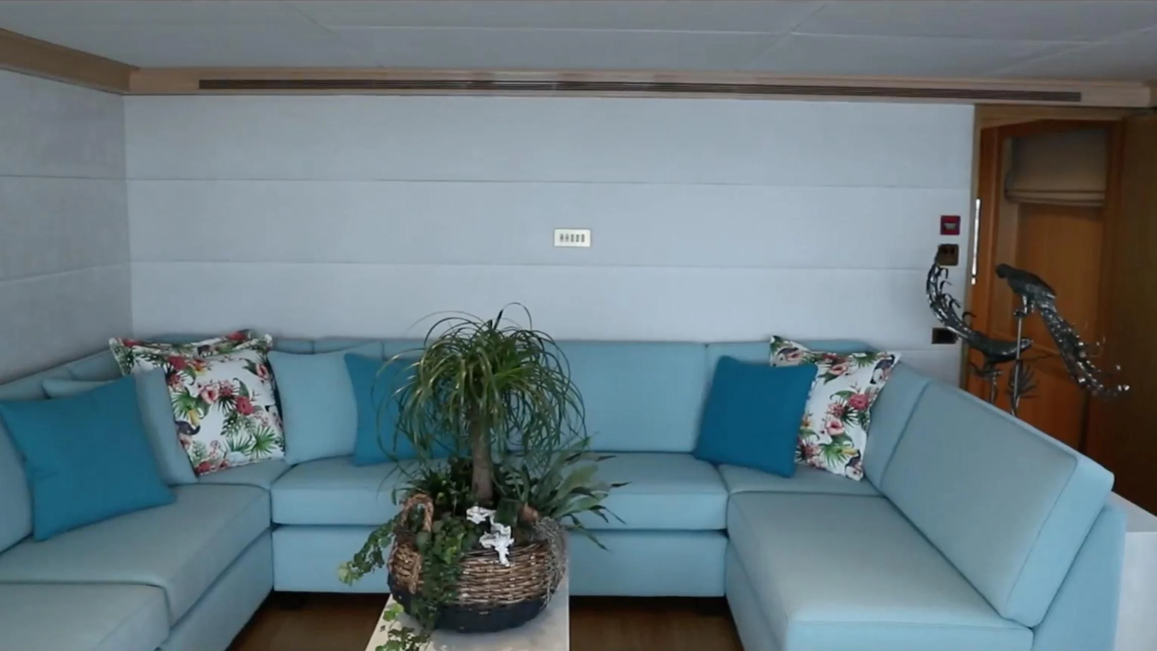 a living room with a couch and a plant aboard ANNA J Yacht for Sale
