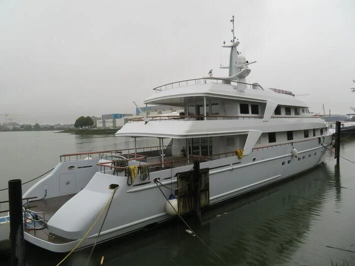 a white boat docked aboard ANNA J Yacht for Sale