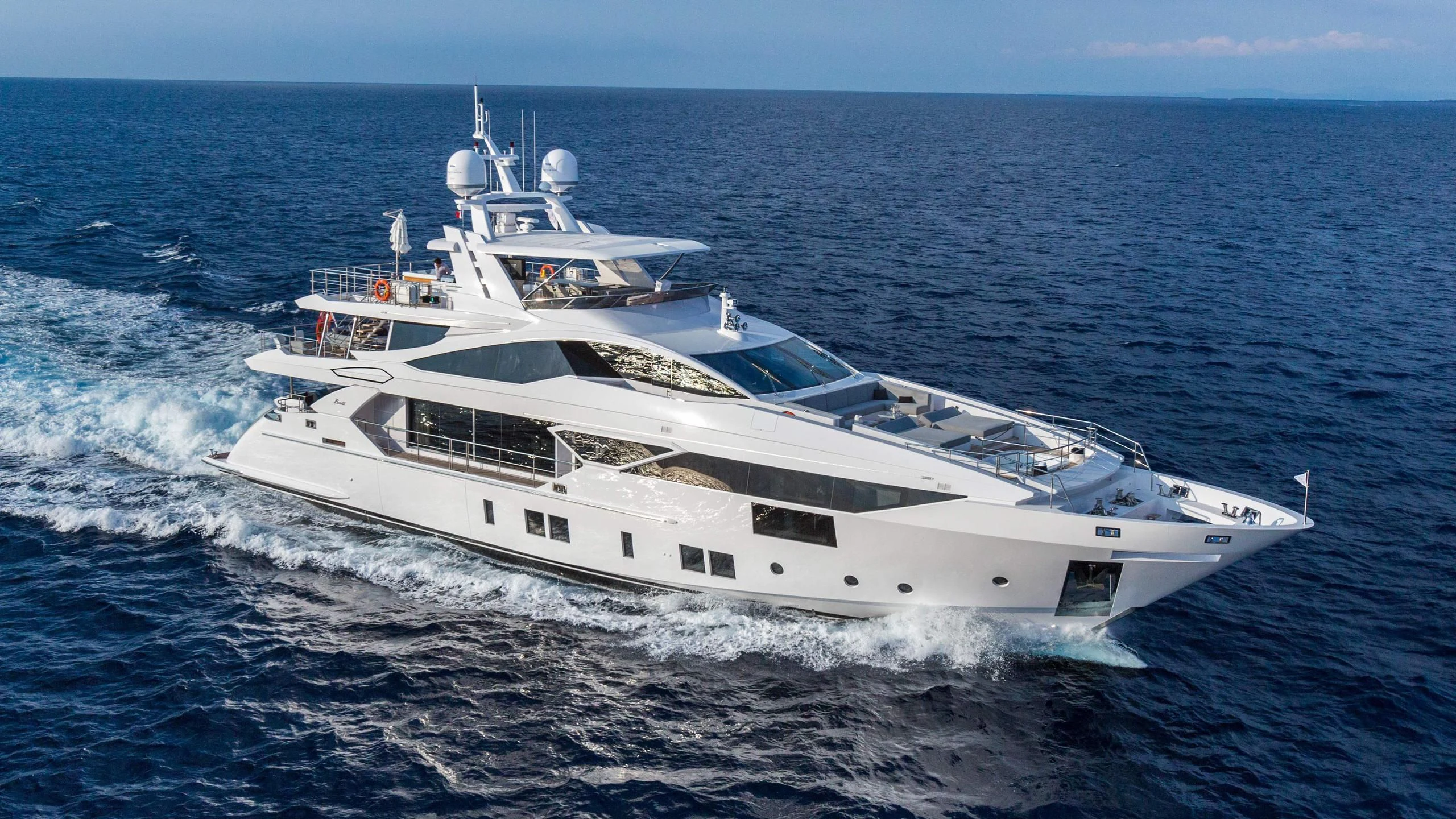 a white yacht on the water aboard HAPPY D Yacht for Sale