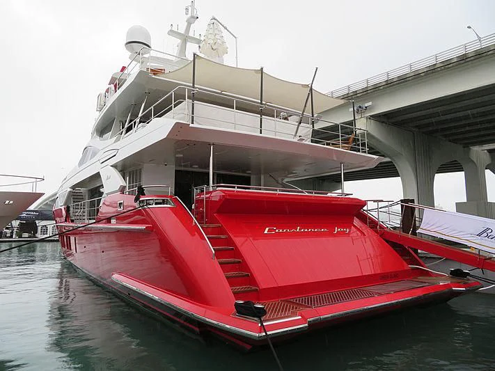 a red boat on the water aboard HAPPY D Yacht for Sale