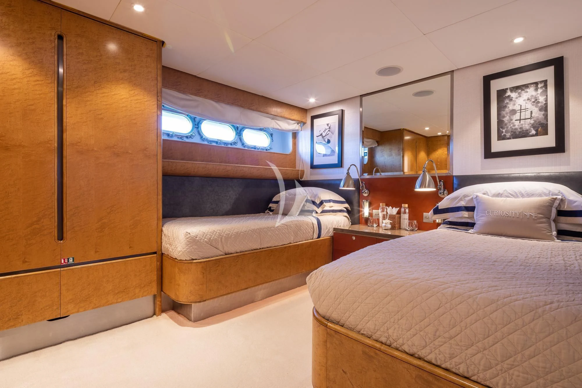 a room with two beds aboard CURIOSITY Yacht for Sale