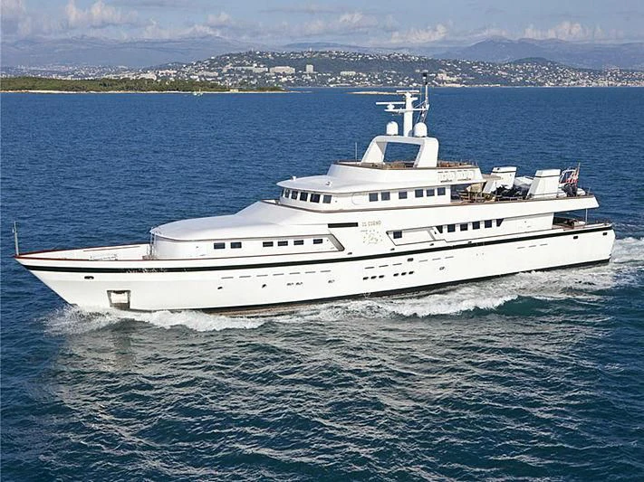 a large white boat in the water aboard CURIOSITY Yacht for Sale