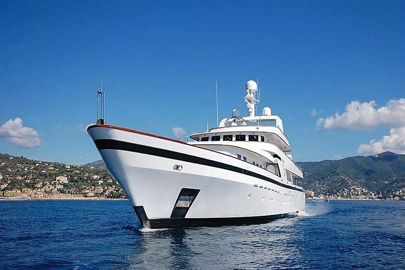 a white yacht in the water aboard CURIOSITY Yacht for Sale
