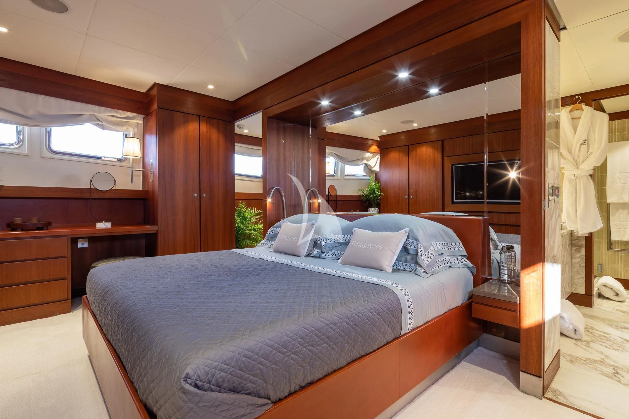 a bed in a room aboard CURIOSITY Yacht for Sale