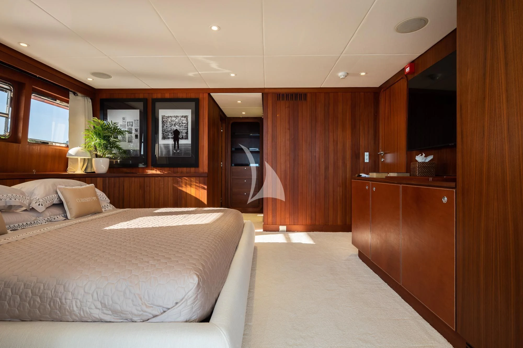 a hotel room with a bed aboard CURIOSITY Yacht for Sale