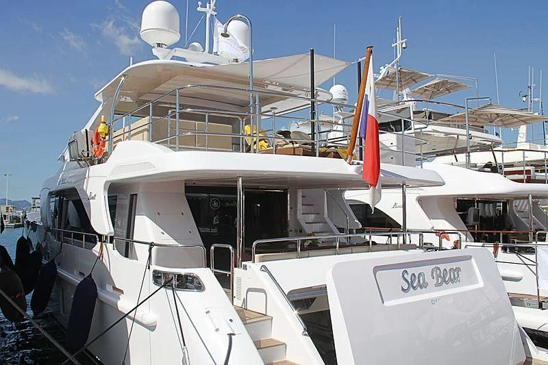 a boat with a flag on the front aboard SEA BEAR Yacht for Sale
