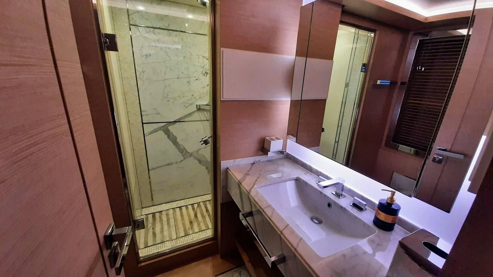 a bathroom with a sink and a mirror aboard SEA BEAR Yacht for Sale