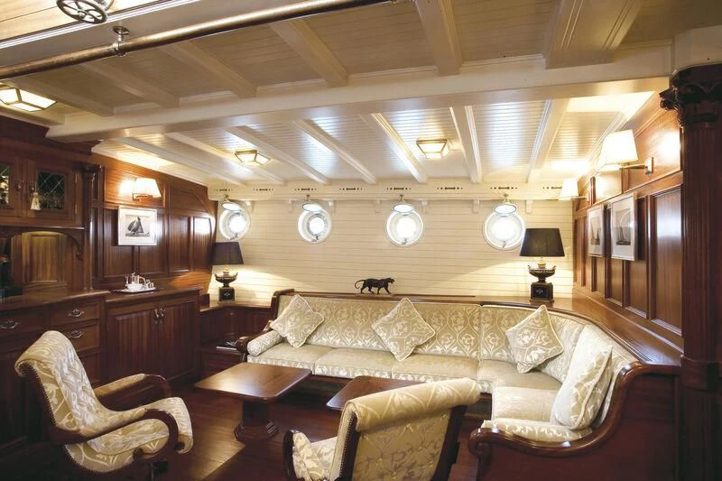 a living room with a couch and a table aboard ELEONORA E Yacht for Sale