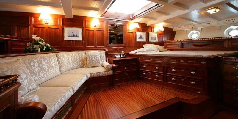 a large room with a bed and a couch aboard ELEONORA E Yacht for Sale