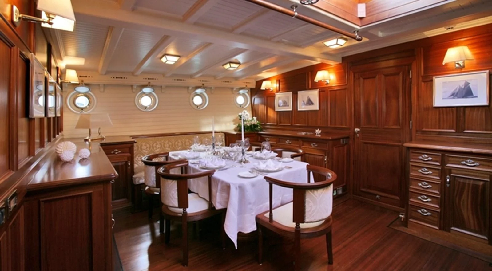 a dining room with a table aboard ELEONORA E Yacht for Sale