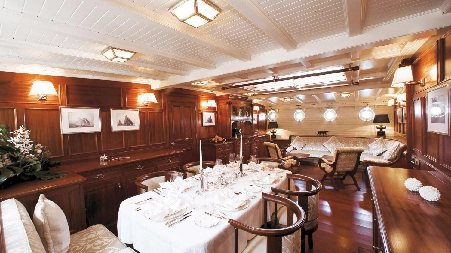 a large room with tables and chairs aboard ELEONORA E Yacht for Sale