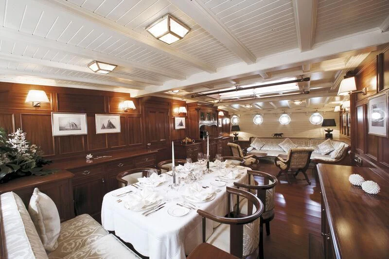 a large room with tables and chairs aboard ELEONORA E Yacht for Sale