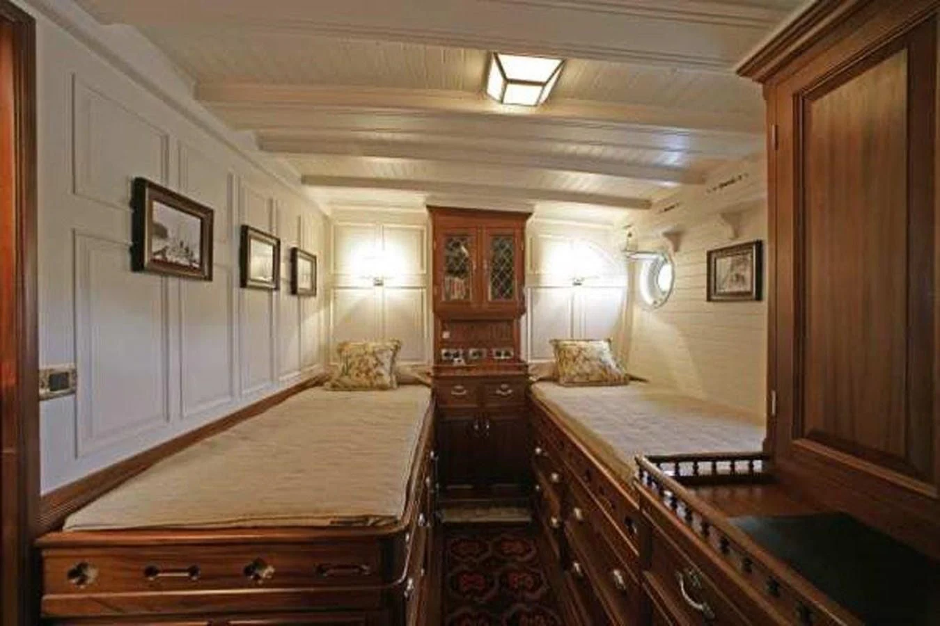 a large room with a bed and a desk aboard ELEONORA E Yacht for Sale