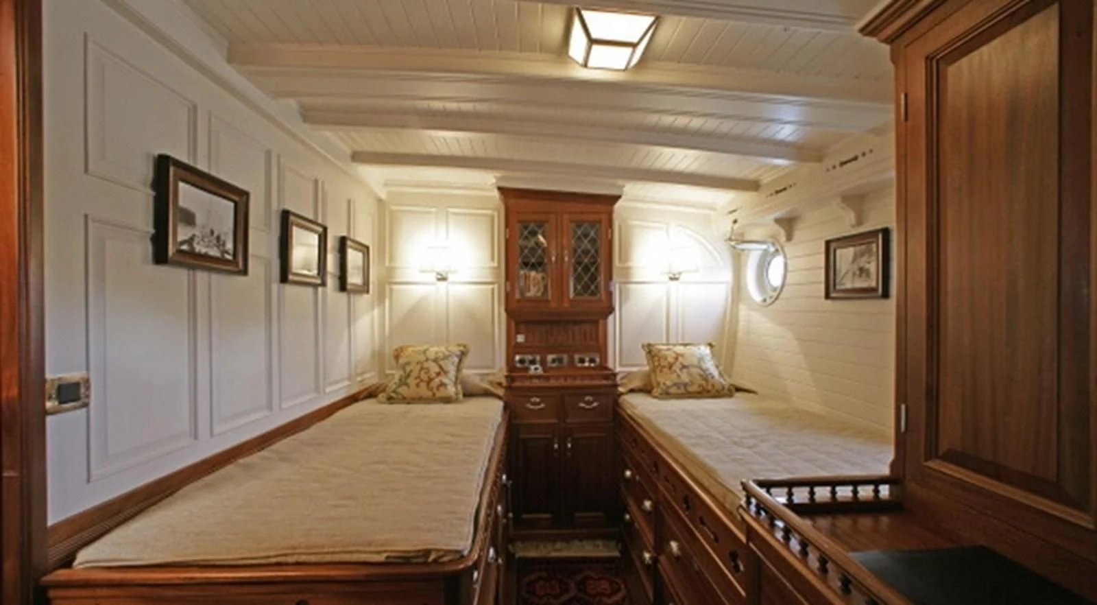 a room with a bed and a dresser aboard ELEONORA E Yacht for Sale