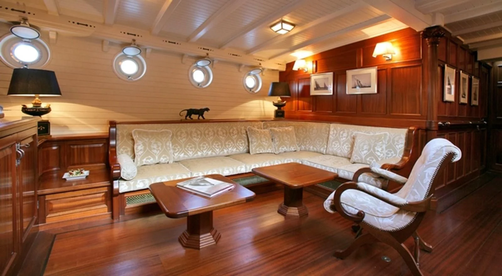 a living room with a couch and a coffee table aboard ELEONORA E Yacht for Sale