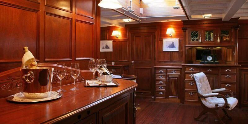 a kitchen with wooden cabinets aboard ELEONORA E Yacht for Sale
