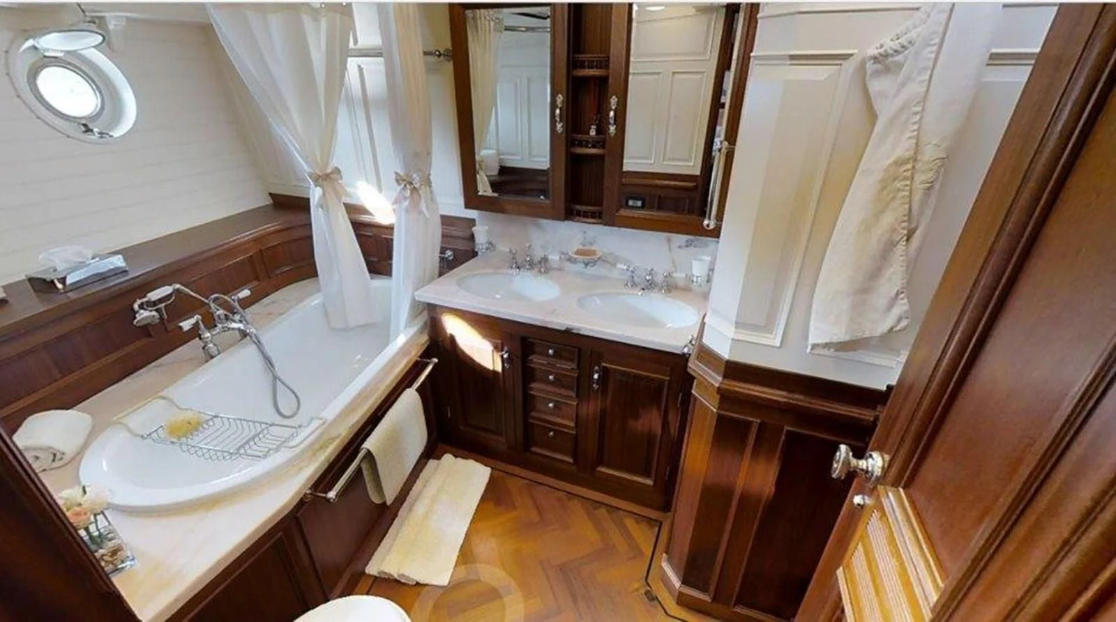 a bathroom with a sink and a mirror aboard ELEONORA E Yacht for Sale