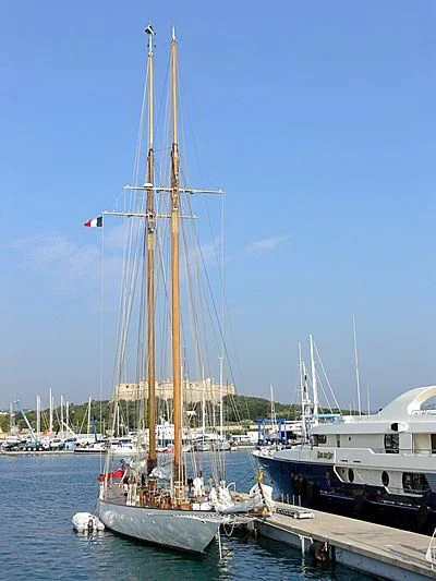 a sailboat docked at a pier aboard ELEONORA E Yacht for Sale