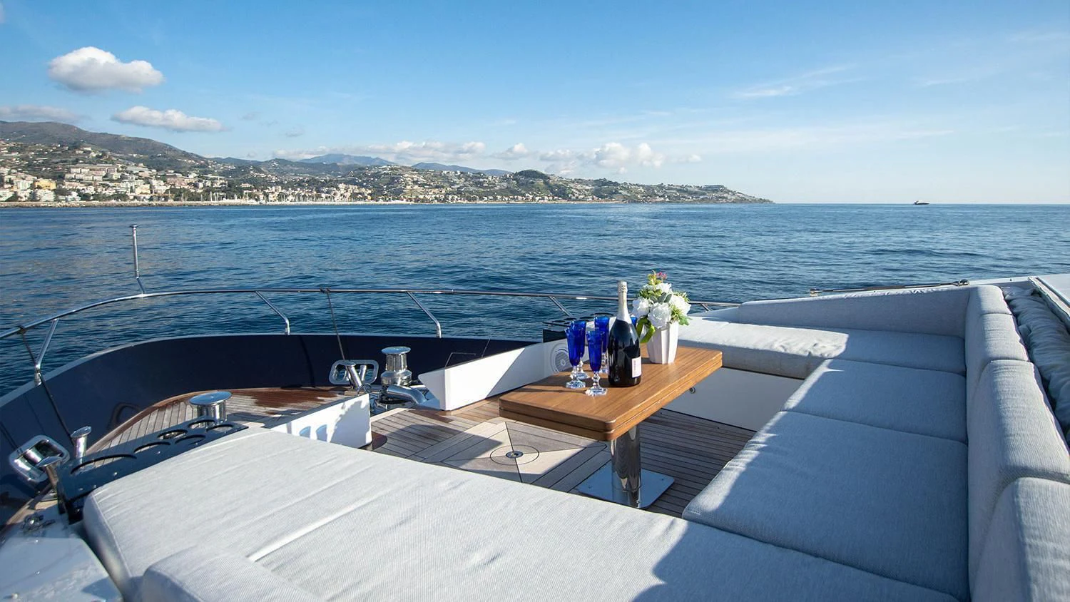 a boat on a deck overlooking a body of water aboard SOLSTICE Yacht for Sale